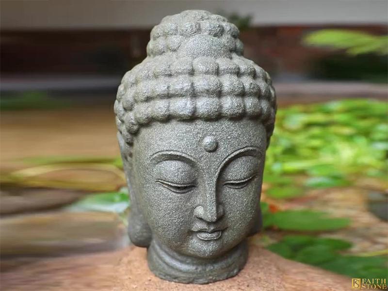 Скульптура головы Будды